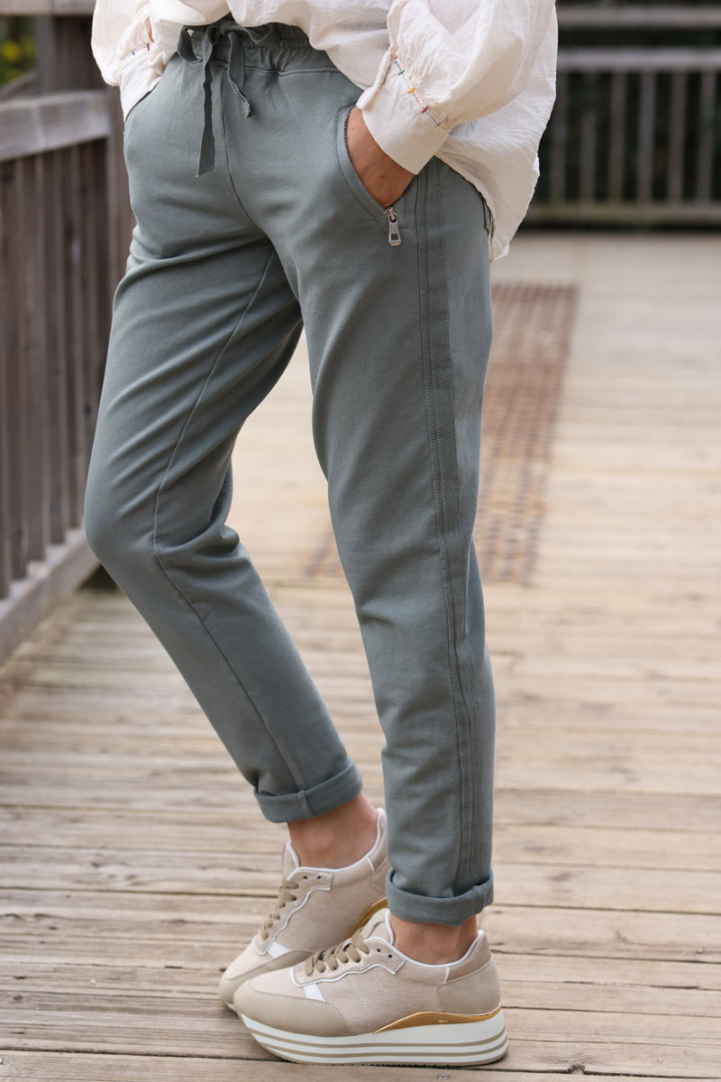 Khaki stretch sweatpants with ribbon outseam zipped pockets