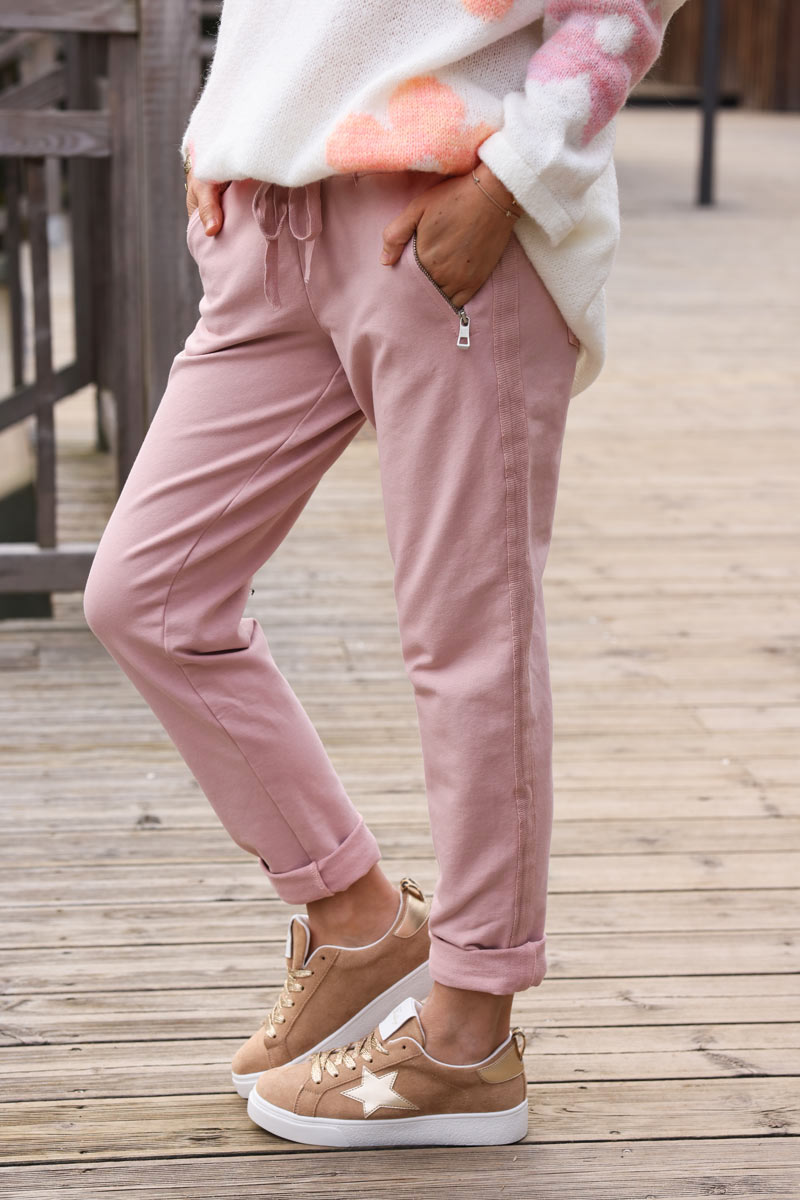 Dusty pink stretch sweatpants with ribbon outseam zipped pockets