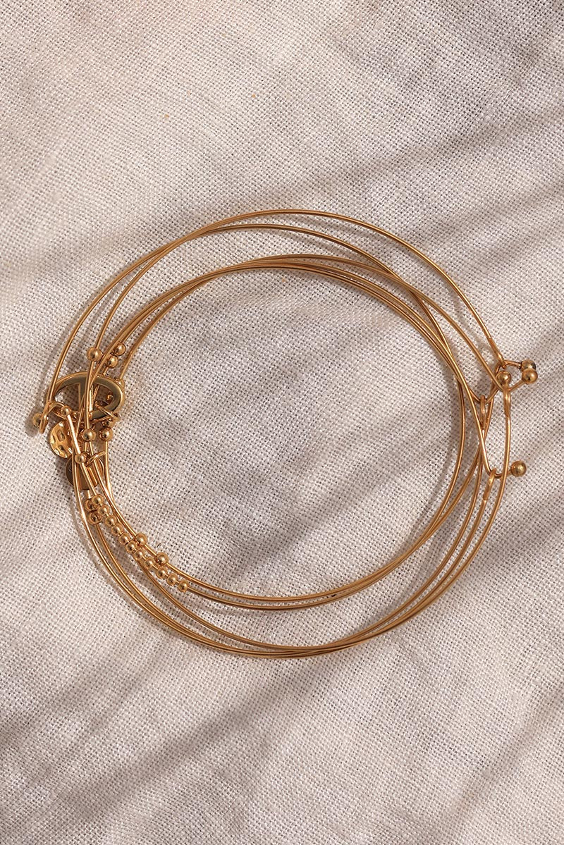 Gold fine bangles with stainless steel charms and pearls