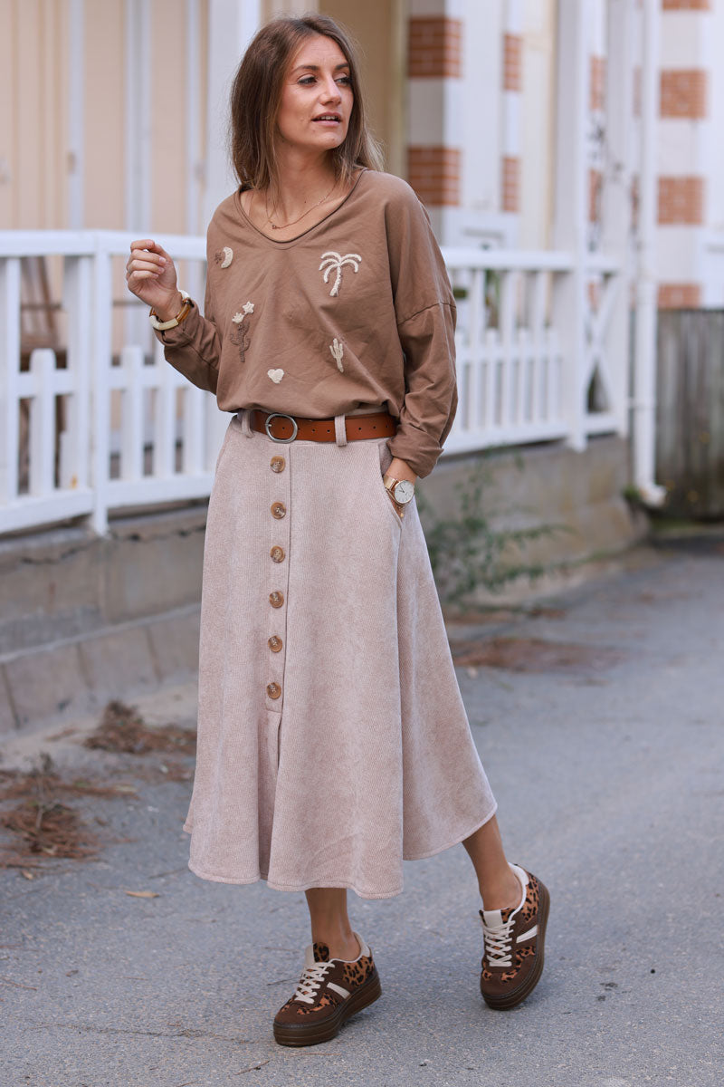 Falda de pana beige con bolsillos con botones y cinturón