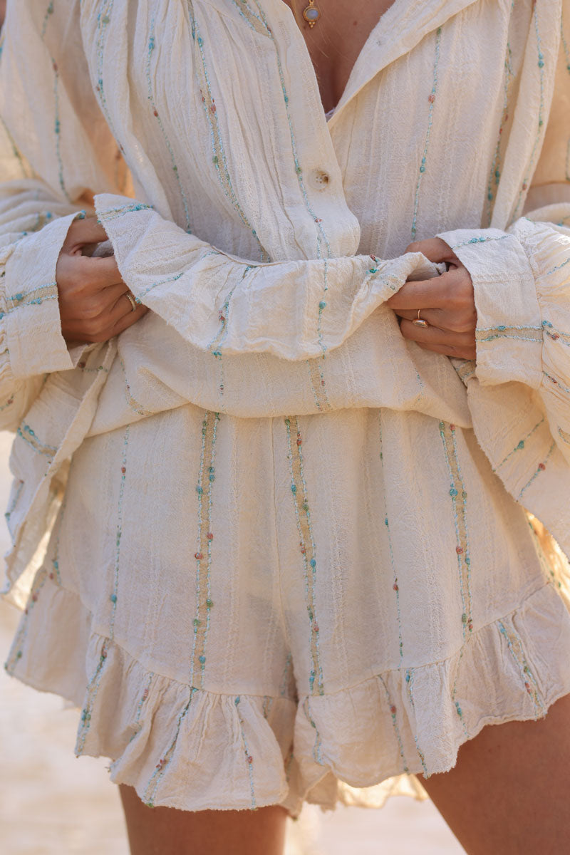 Falda corta beige natural de algodón efecto piqué con hilos brillantes y multicolores