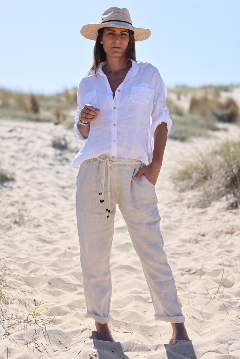 Beige linen trousers with crochet and wooden beaded belt