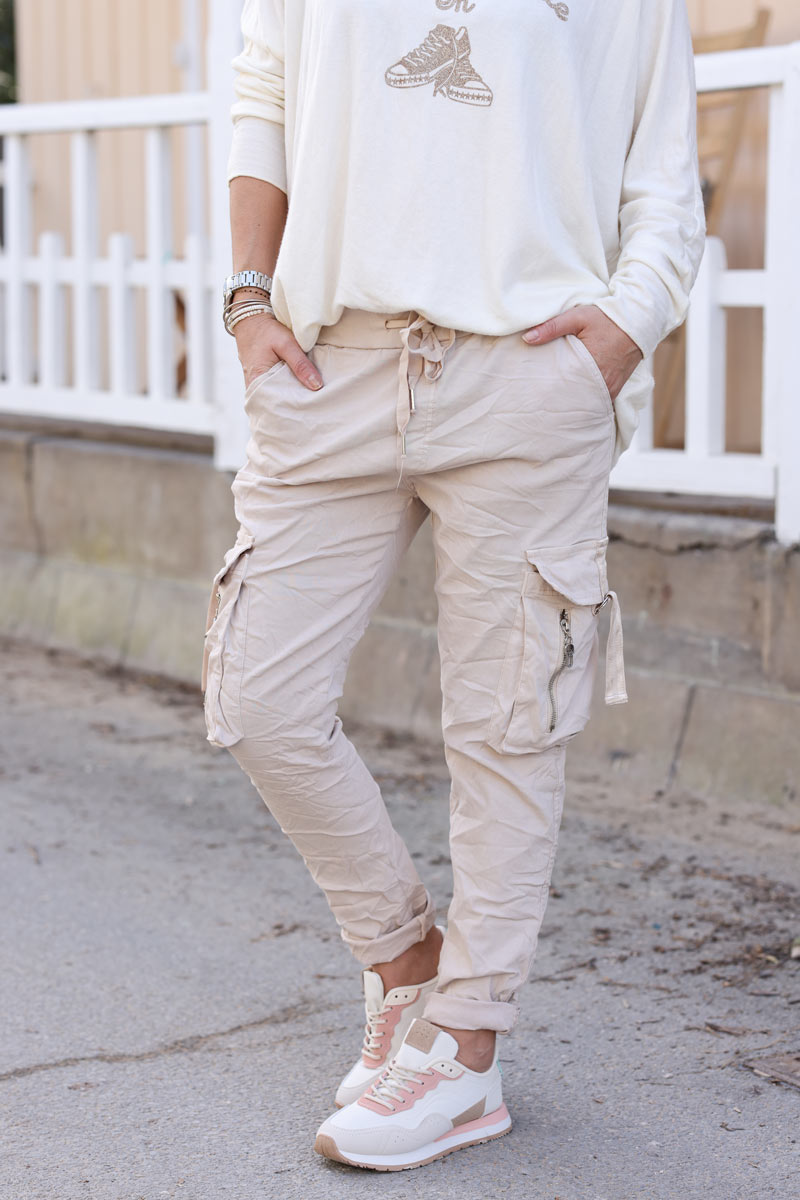 Beige comfort cargo pants with zip pockets and stretch waist