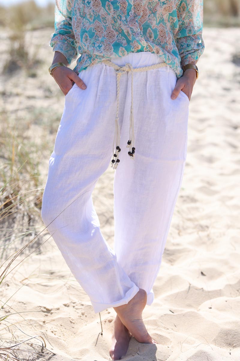 White linen trousers with crochet and wooden beaded belt