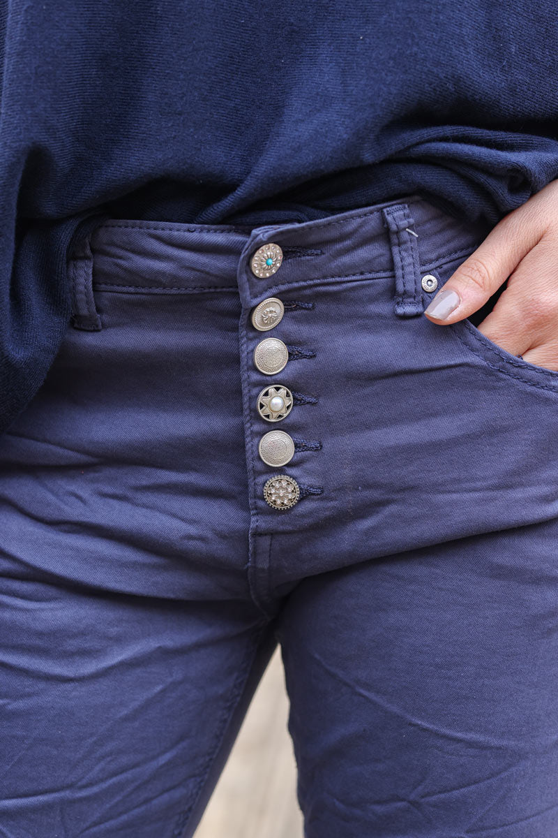 Stretch navy blue denim creased effect jeans with silver vintage buttons