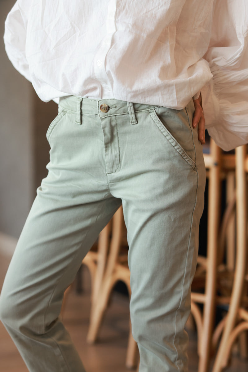 Olive stretch chino pants with tortoise shell buttons