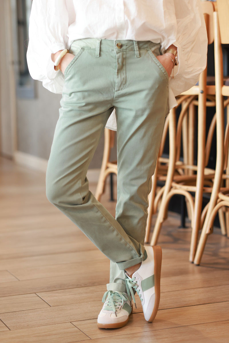 Olive stretch chino pants with tortoise shell buttons