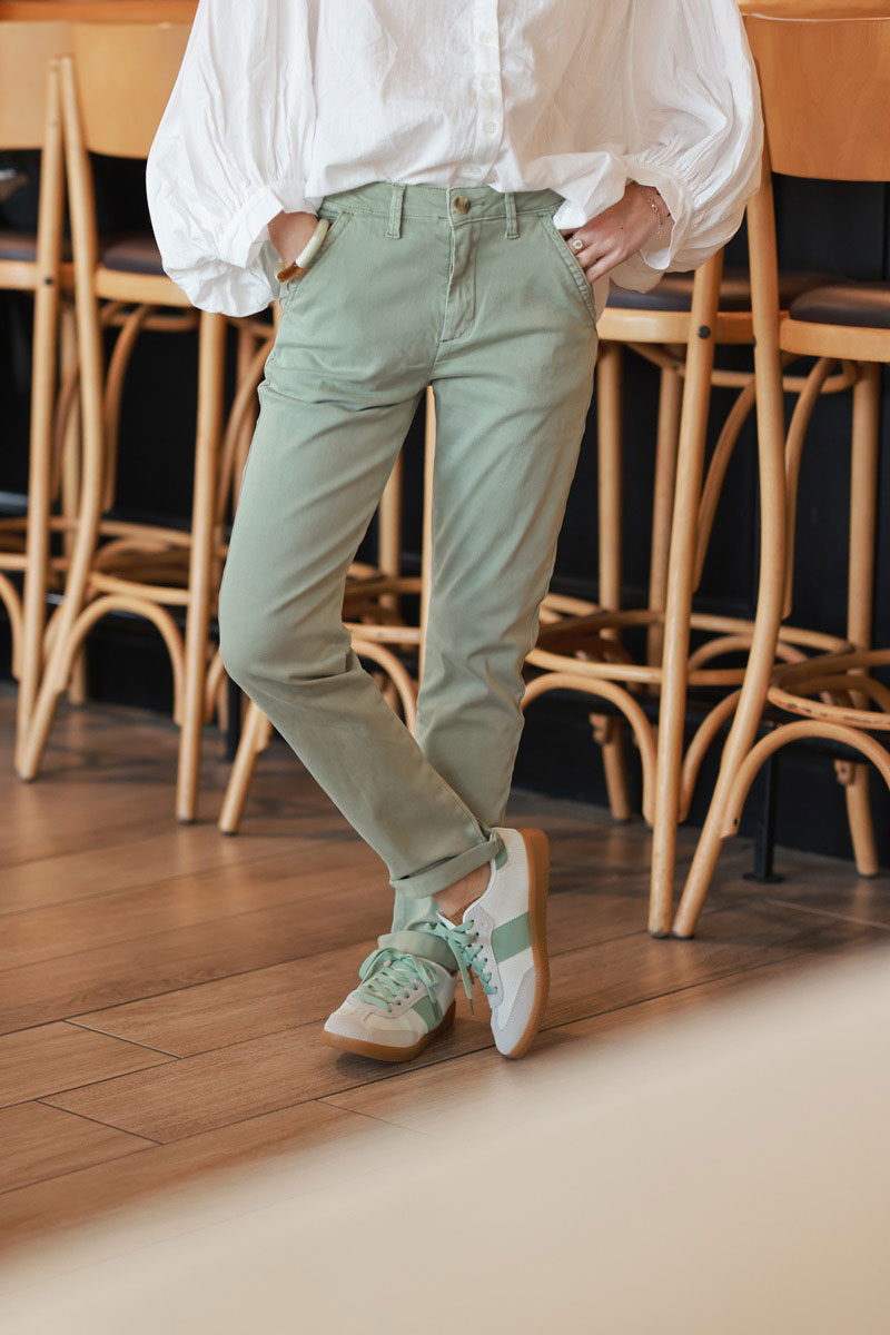 Olive stretch chino pants with tortoise shell buttons