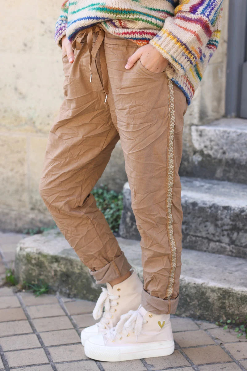 Camel stretch trousers with embroidered glitter star detail edging