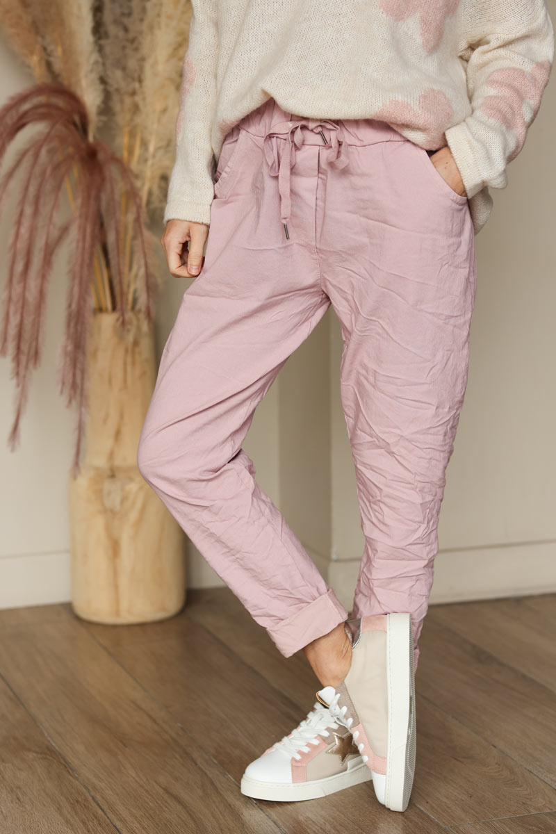 Soft pink comfort and stretch fabric pants with a glitter star