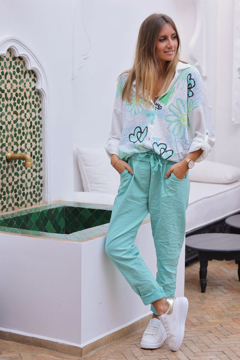 Turquoise comfort and stretch fabric pants with a glitter star