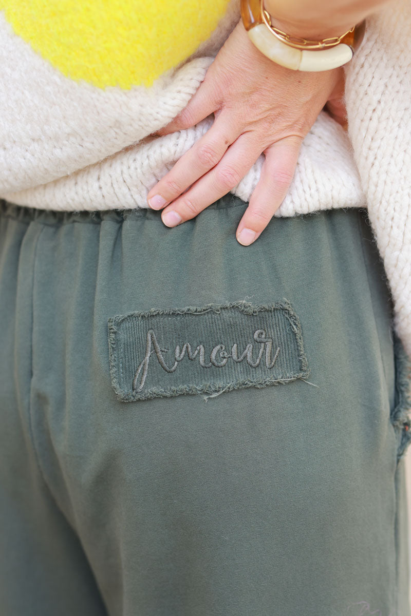 Khaki loose sweatpants with fringe detail pockets