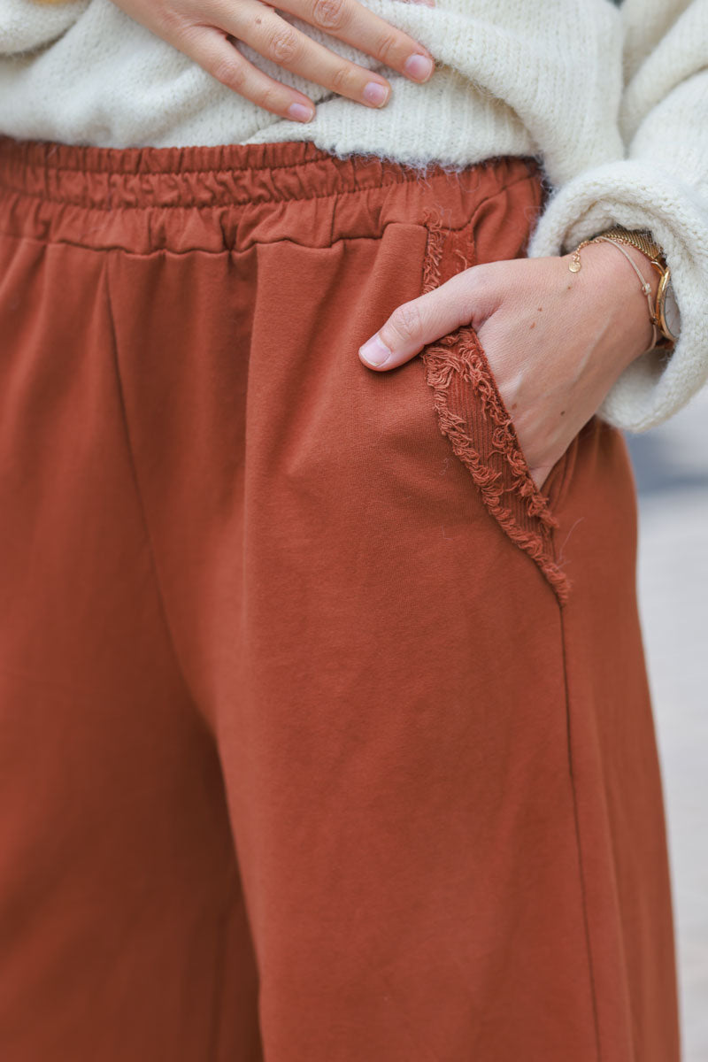 Terracotta loose sweatpants with fringe detail pockets