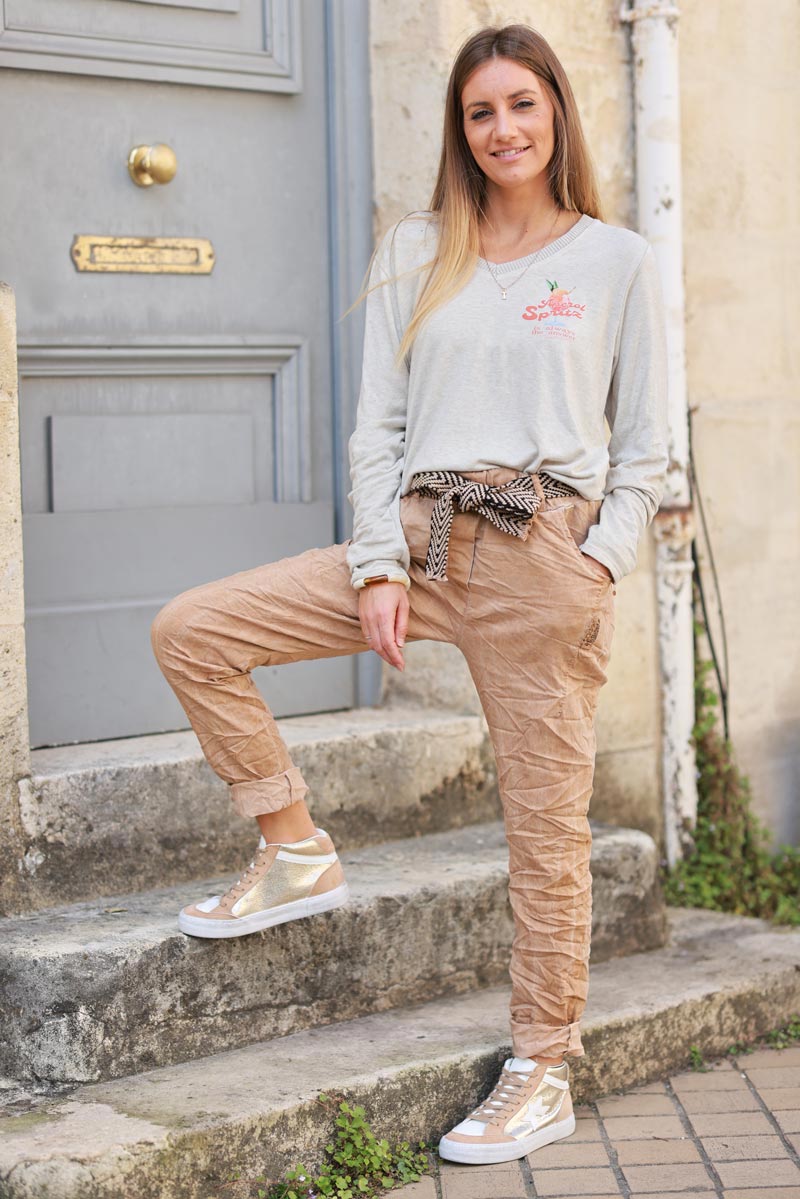 Washed camel comfort and stretch fabric trousers + chevron belt