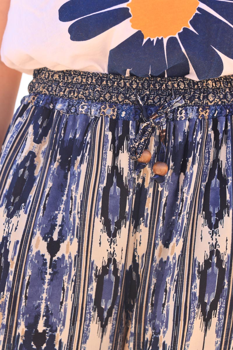 Pantalón fluido con cintura elástica y estampado de rayas glitch azules