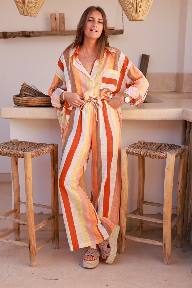 Pantalon fluide taille élastique rayures verticales colorées tons oranges