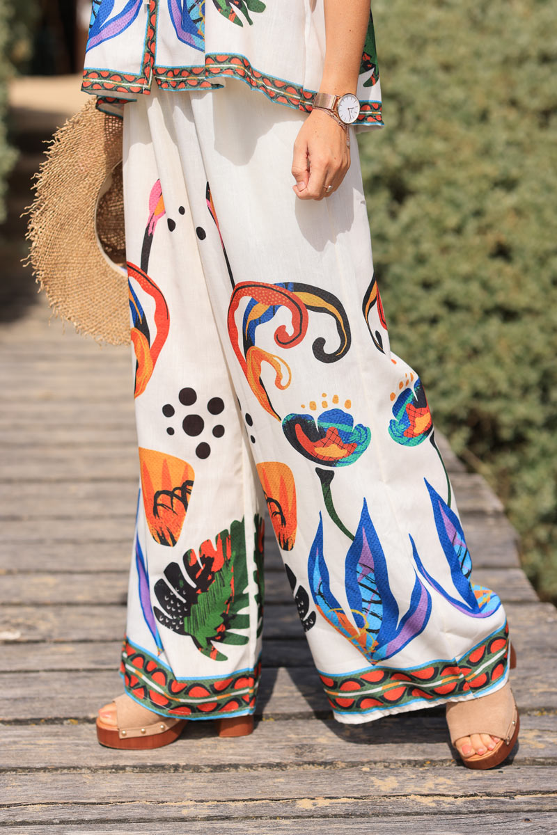 Ecru wide leg pants with abstract coloured print