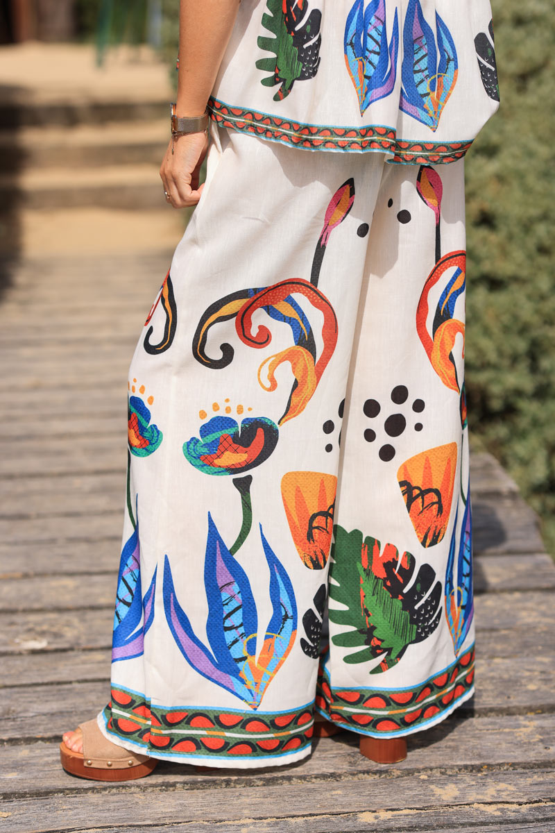 Ecru wide leg pants with abstract coloured print