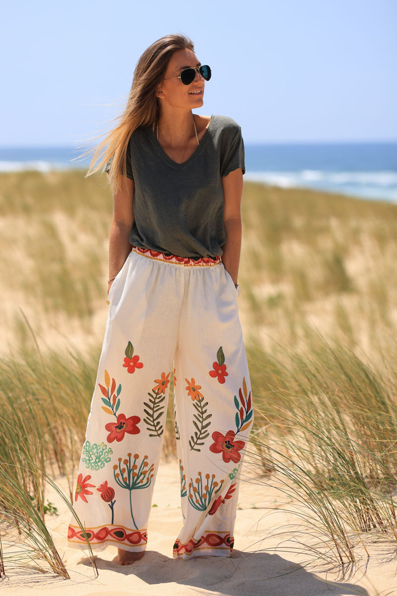 Wide leg ecru pants with artistic floral print and elastic waistband