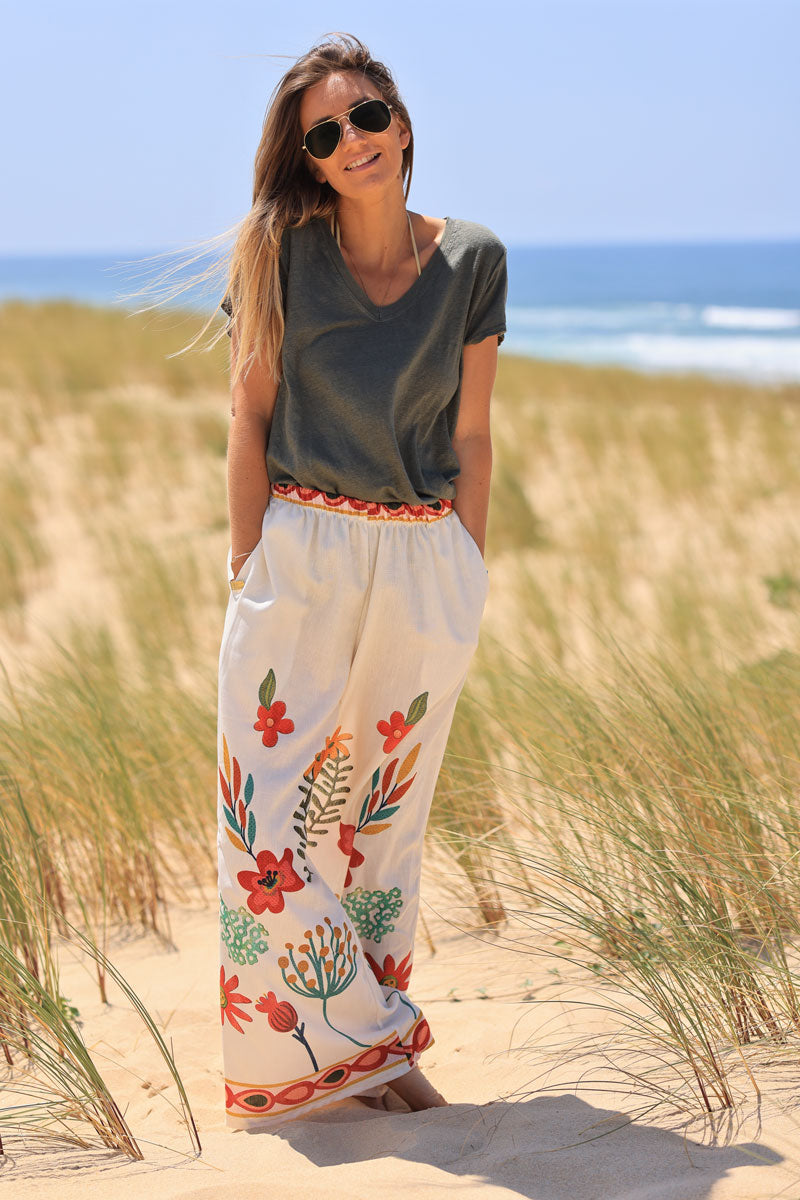 Wide leg ecru pants with artistic floral print and elastic waistband