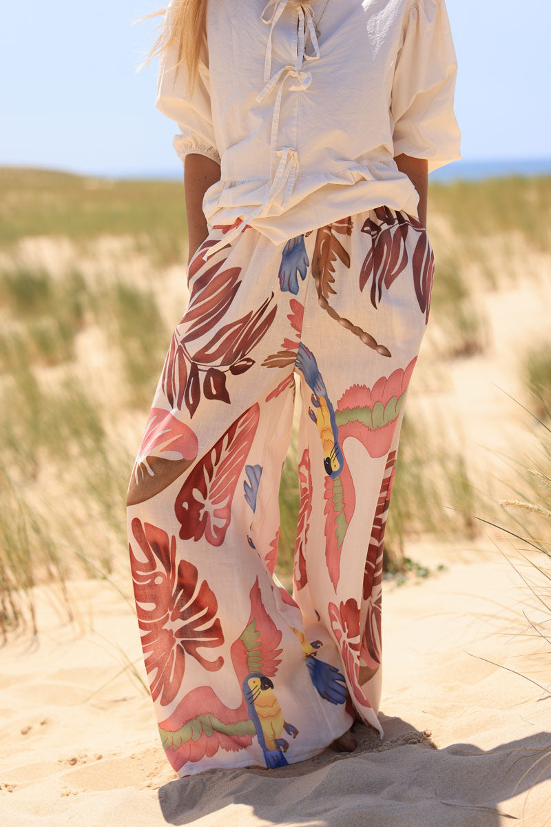 Wide leg ecru pants with pink watercolor palm and parrot print
