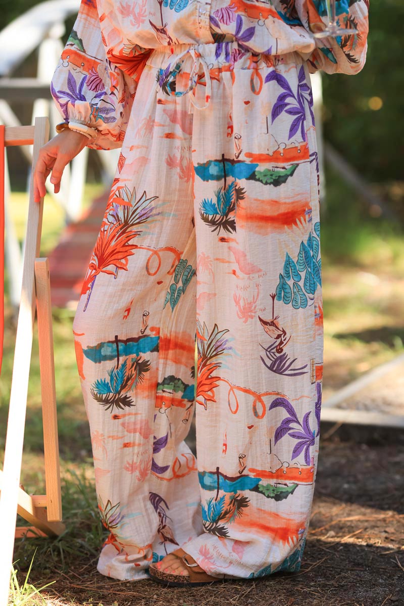 Ecru wide leg floaty pants with random colorful summer beach print