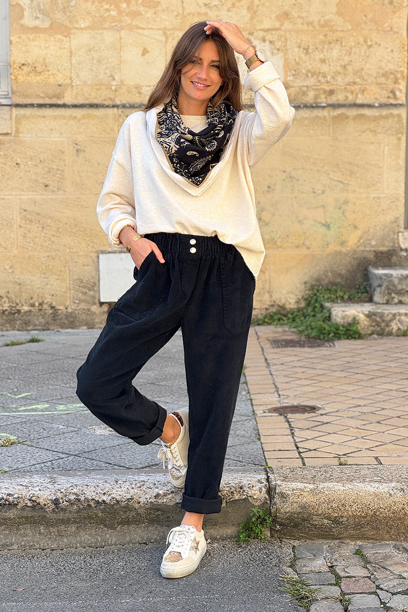 Pantalon noir en velours côtelé coupe paperbag ceinture élastique