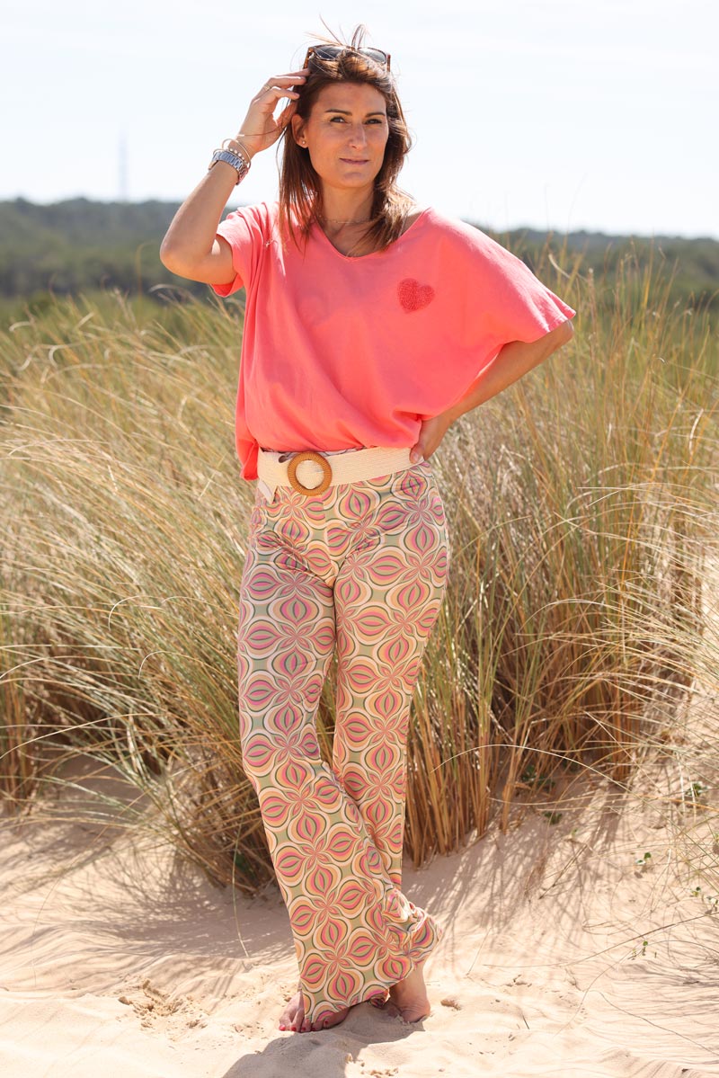 Stretch flared trousers with 70s inspired pink kaleidoscope print