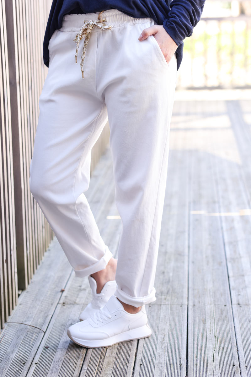 Off white extra stretch canvas pants with elastic waistband and glitter ties