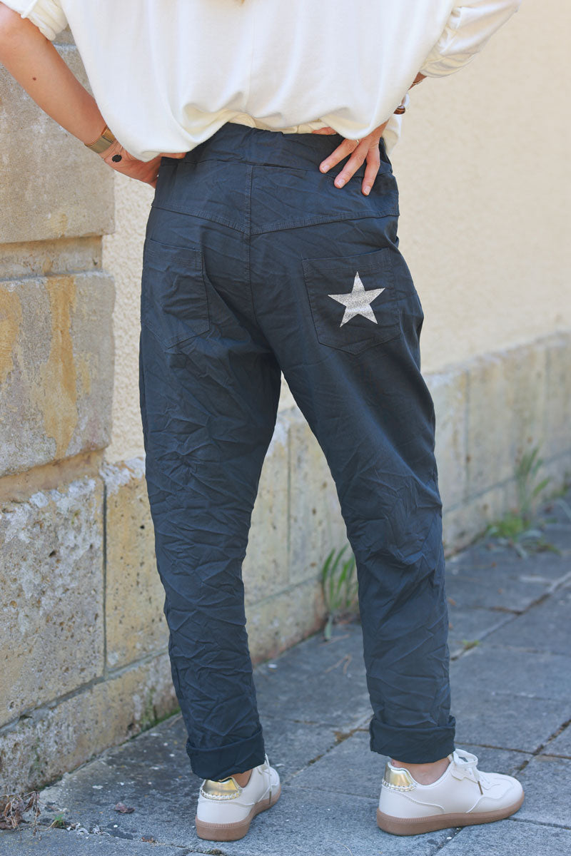 Gray comfort and stretch fabric pants with a glitter star