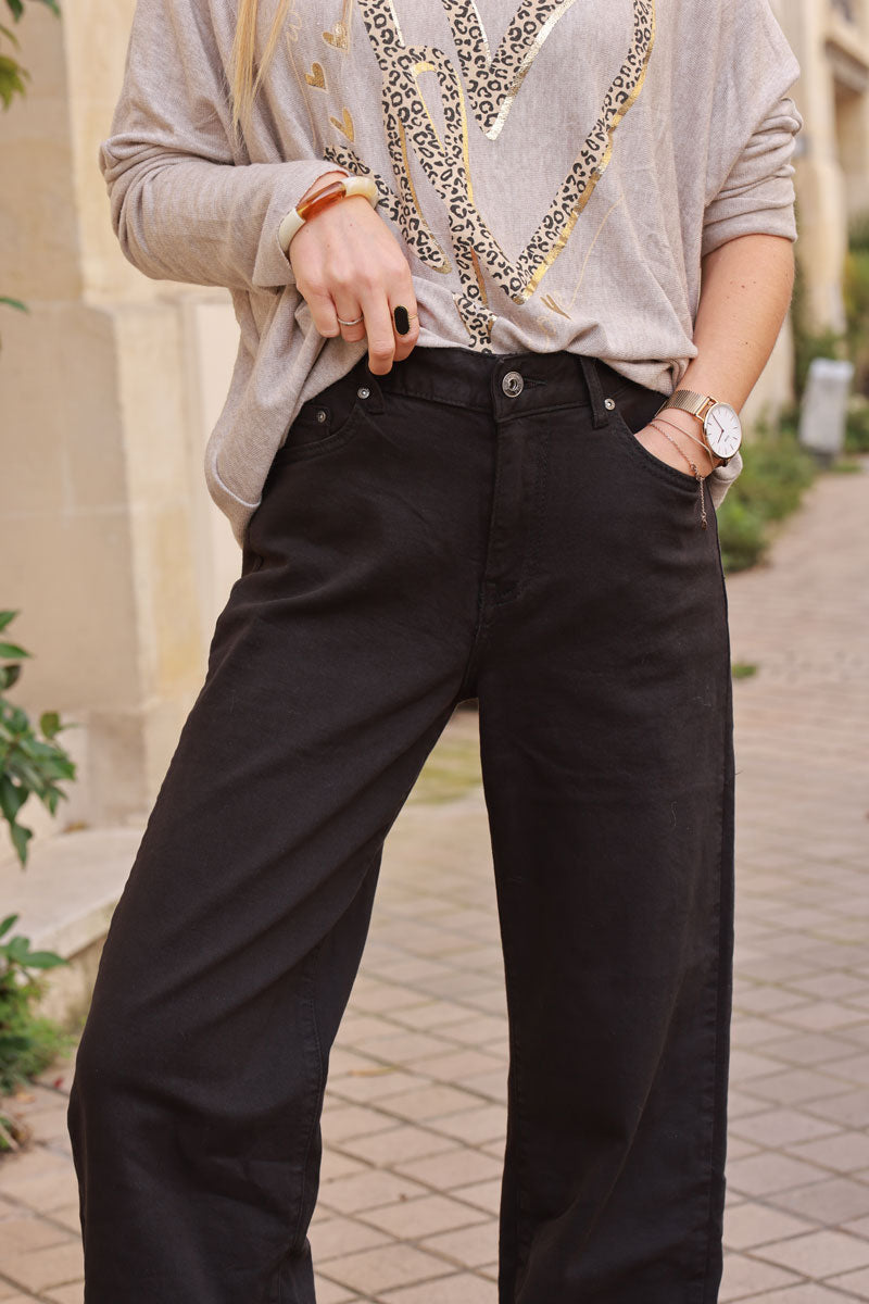 Pantalón elástico negro de corte ancho con bajo ancho