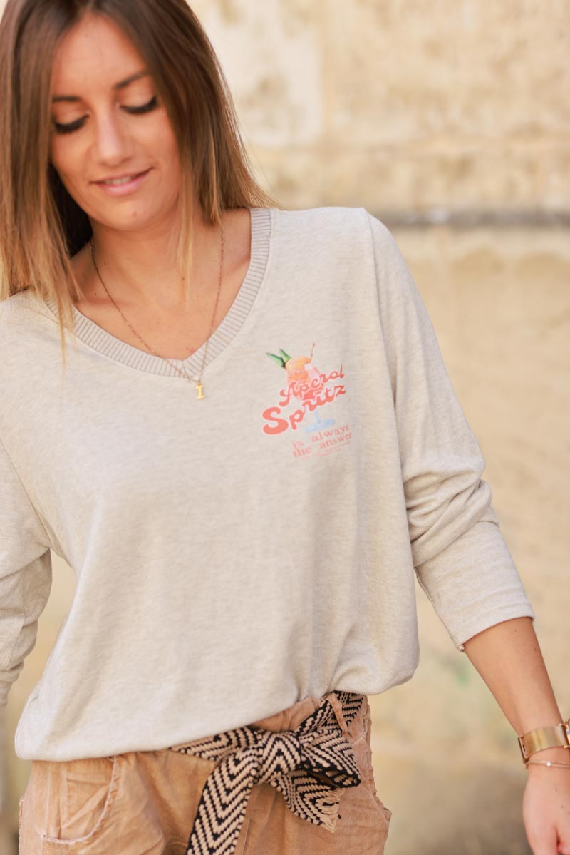 Petit pull beige en jersey col v cotele cocktail Apérol Spritz