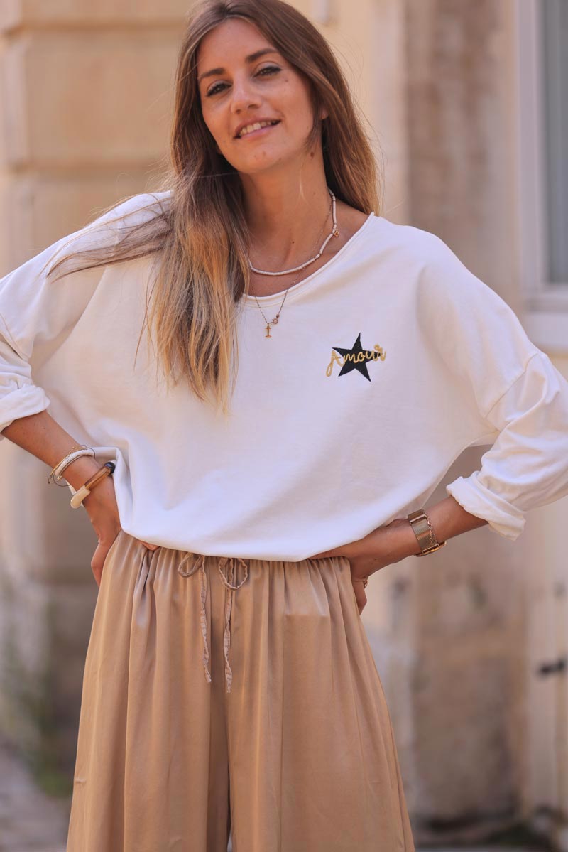 White comfort sweater with gold star and 'amour' embroidery