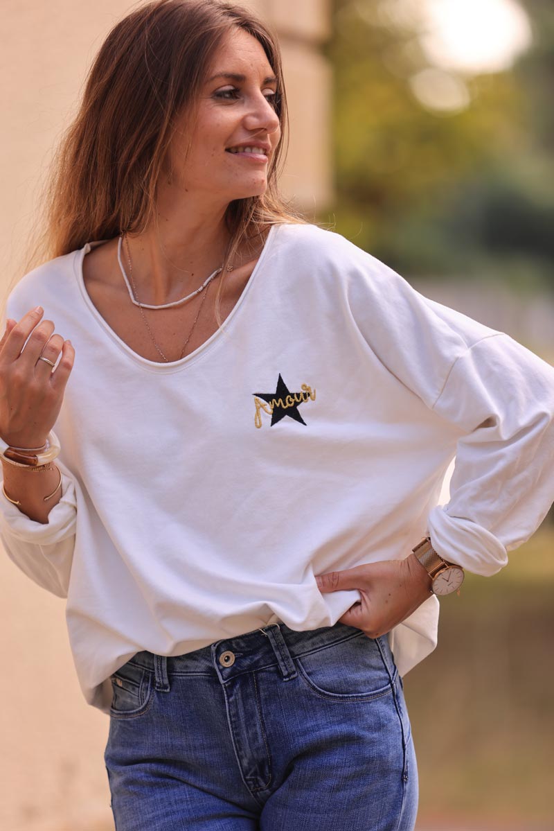 White comfort sweater with gold star and 'amour' embroidery