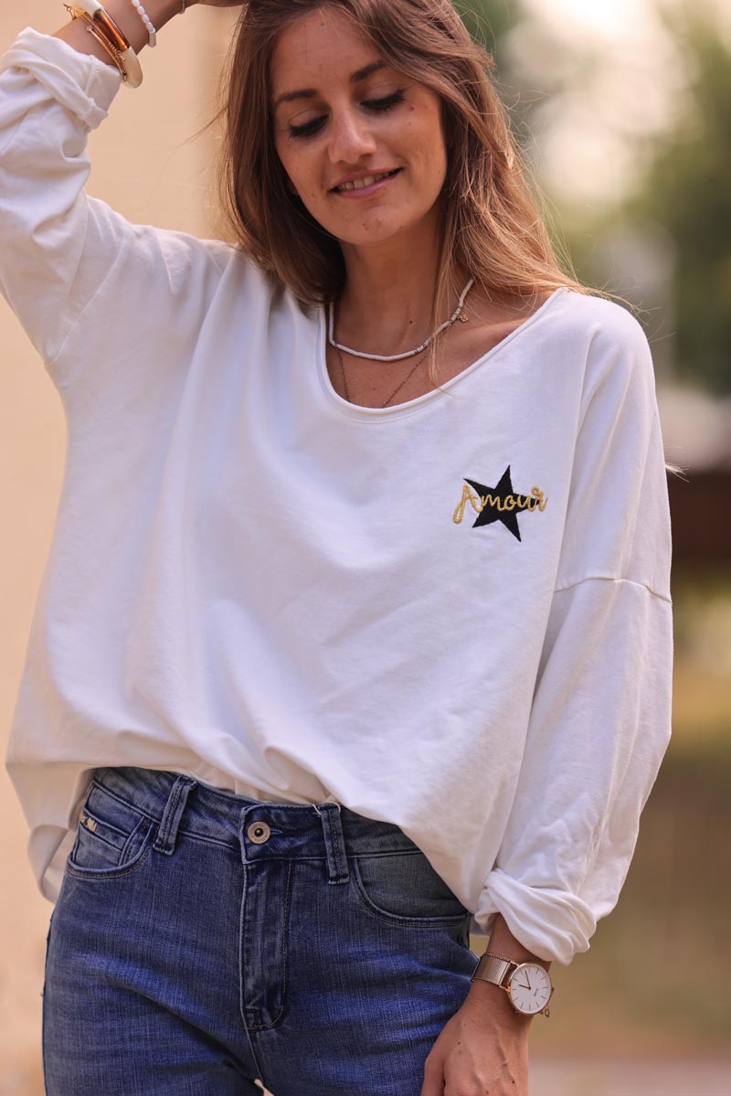 White comfort sweater with gold star and 'amour' embroidery