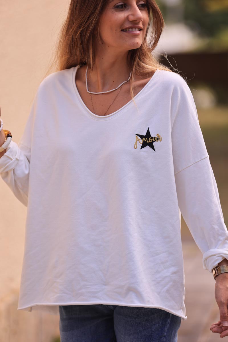 White comfort sweater with gold star and 'amour' embroidery