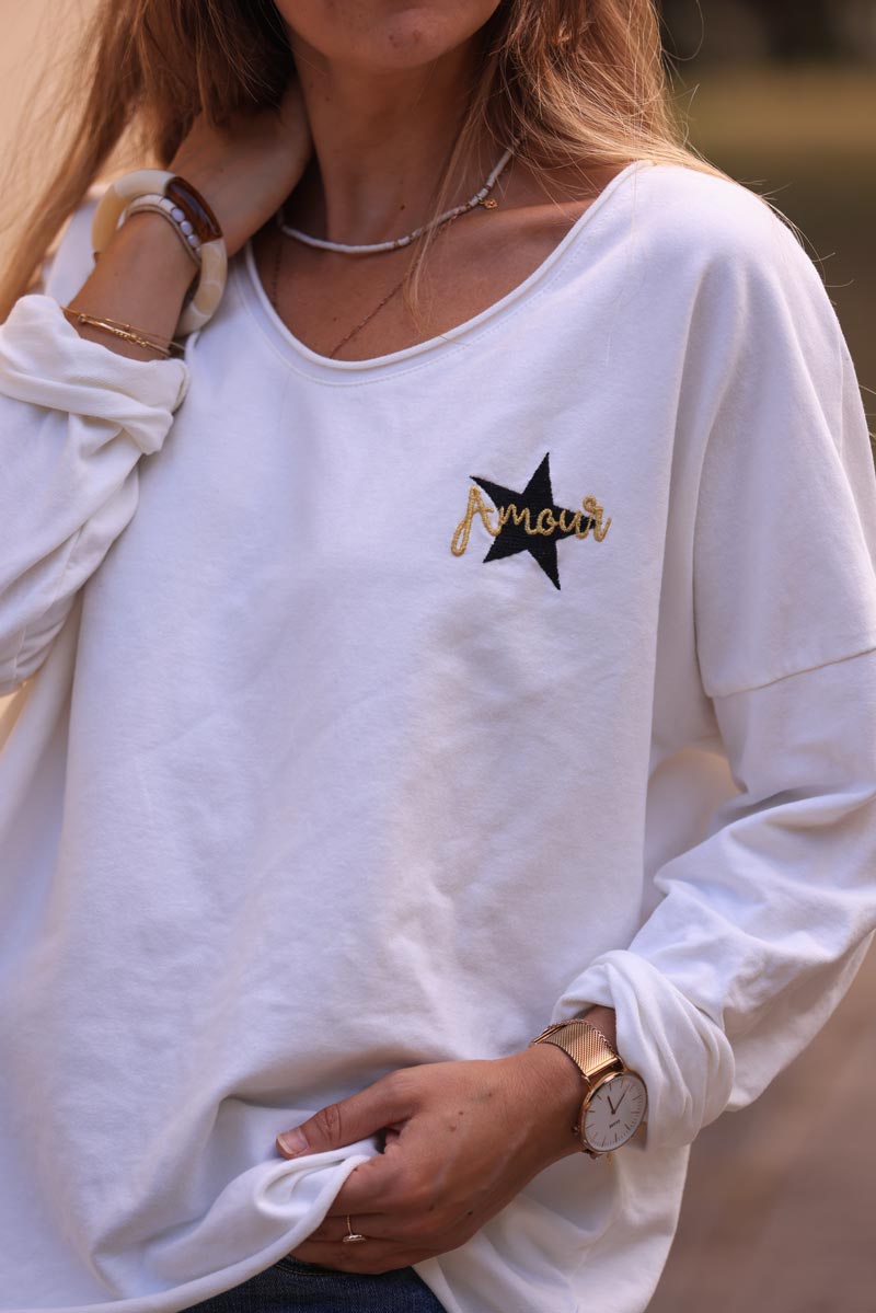 White comfort sweater with gold star and 'amour' embroidery