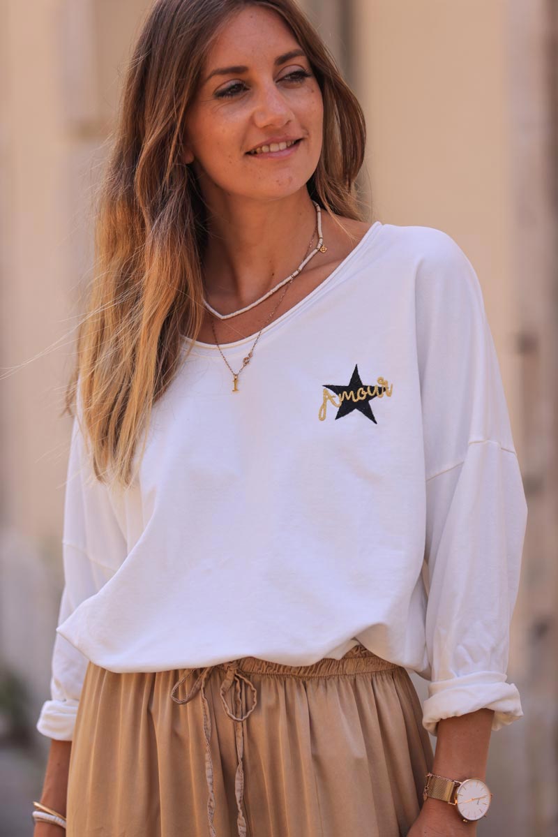 White comfort sweater with gold star and 'amour' embroidery