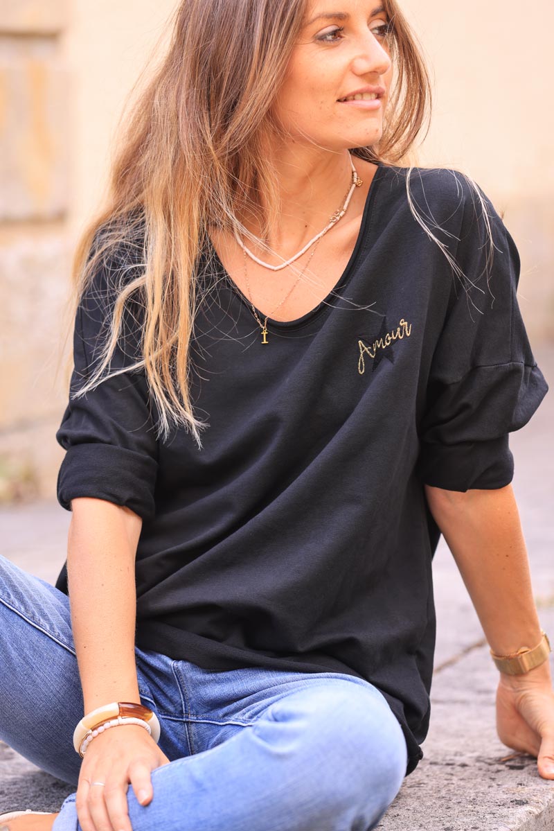 Black comfort sweater with gold star and 'amour' embroidery