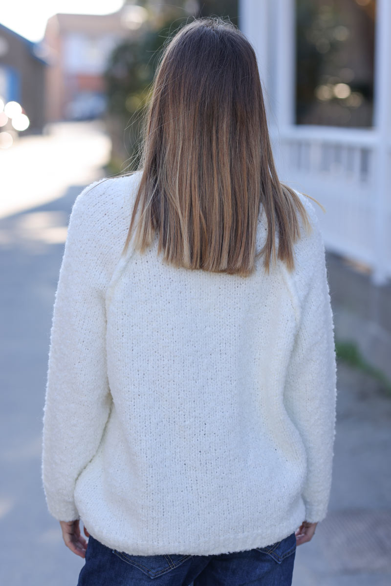 Off white bouclette knit sweater with inside out seams