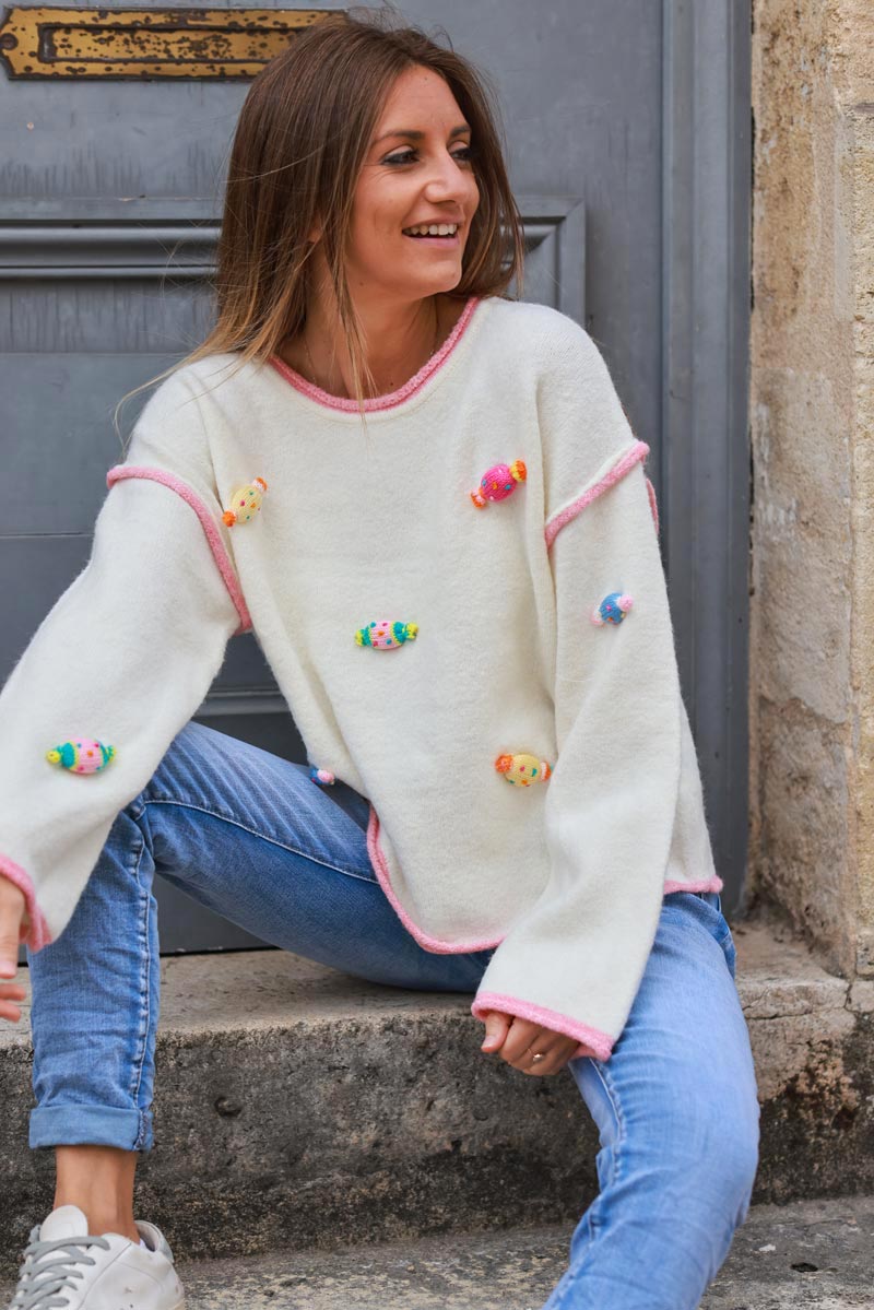 Off white sweater with small crochet candies in vibrant colors