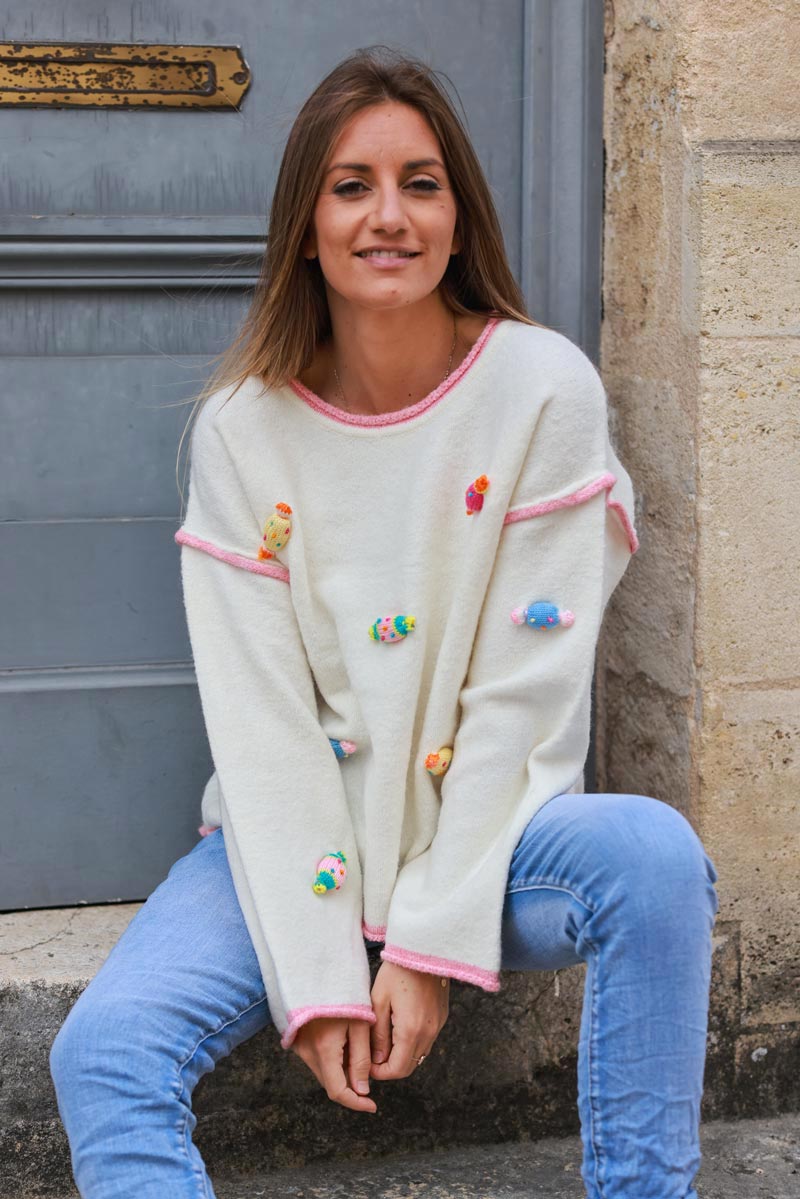 Off white sweater with small crochet candies in vibrant colors