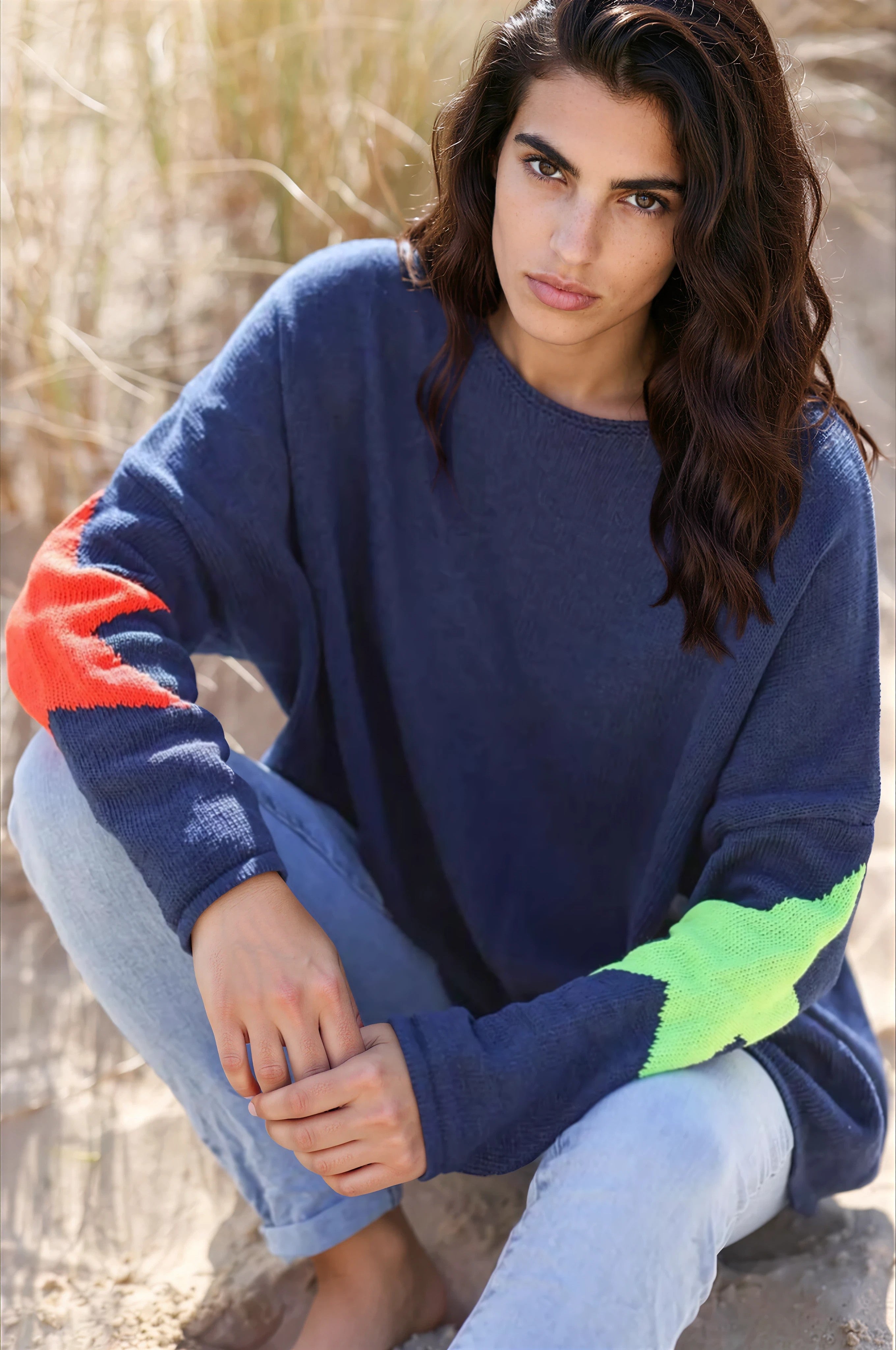 Navy blue knit sweater with colourful stars