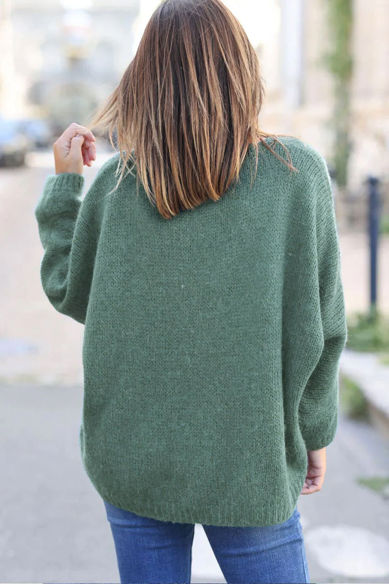 Jersey de punto verde celadón con cuello de pico y manga murciélago