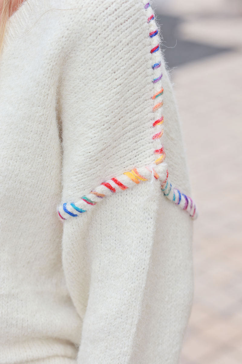 Ecru chunky knit sweater with colorful stitch detail