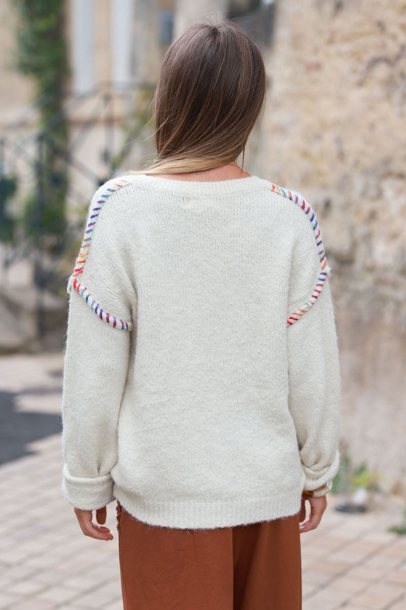 Ecru chunky knit sweater with colorful stitch detail