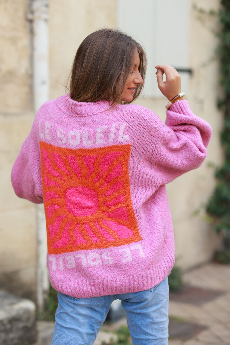 Pink chunky knit sweater with vibrant sun embroidery