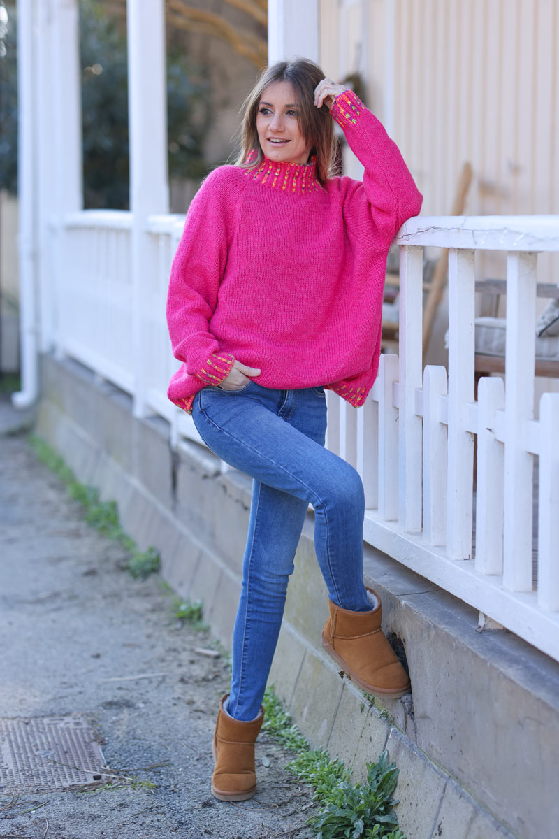 Soft knit sweater in fuchsia with funnel neck multicoloured stitching