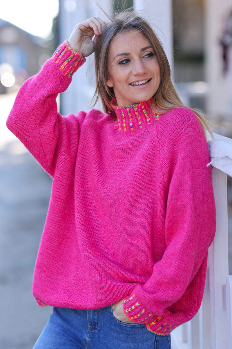 Soft knit sweater in fuchsia with funnel neck multicoloured stitching