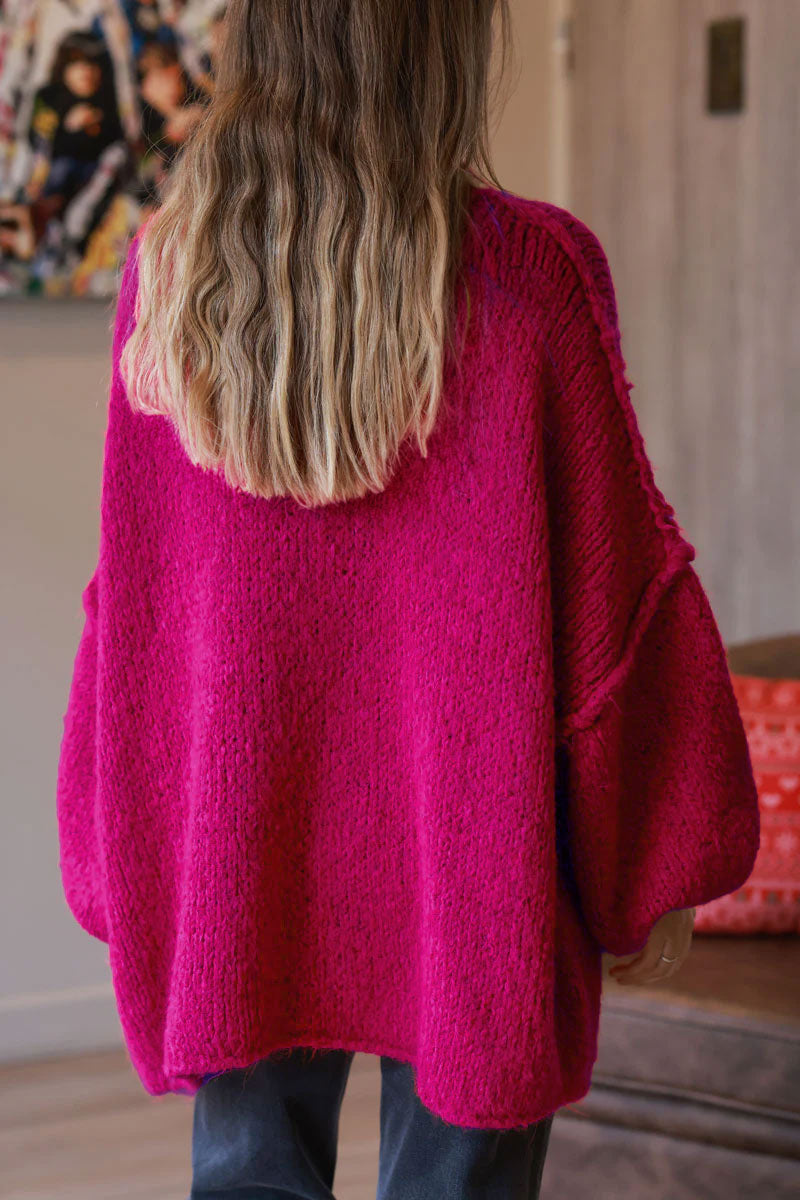 Gros pull large framboise en maille chaude couture apparente